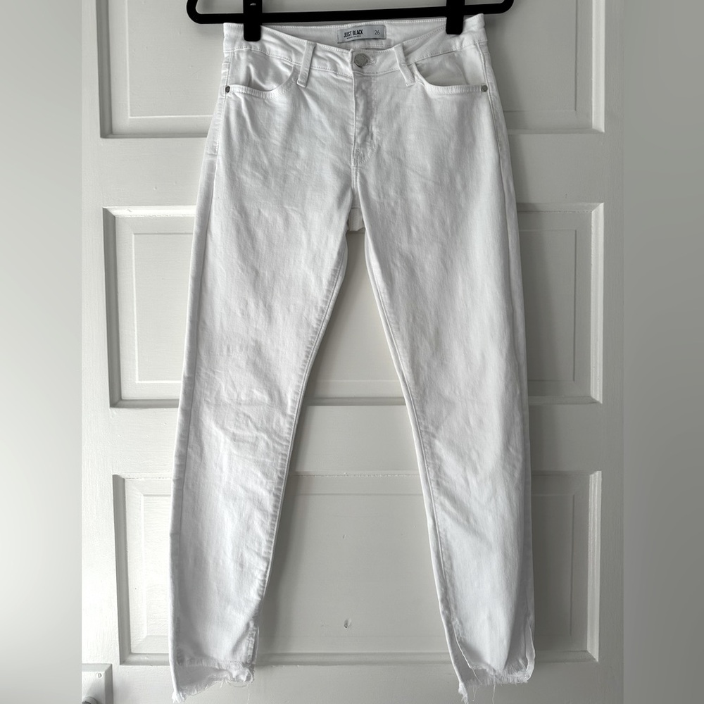 Just Black Denim white skinny jeans with frayed hi-lo hemline